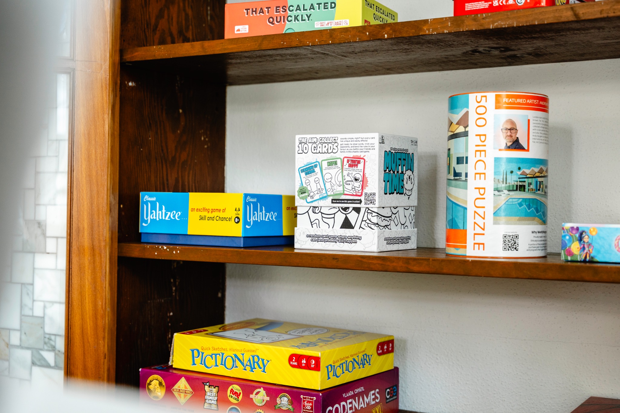 Game cabinet stocked with board games and puzzles